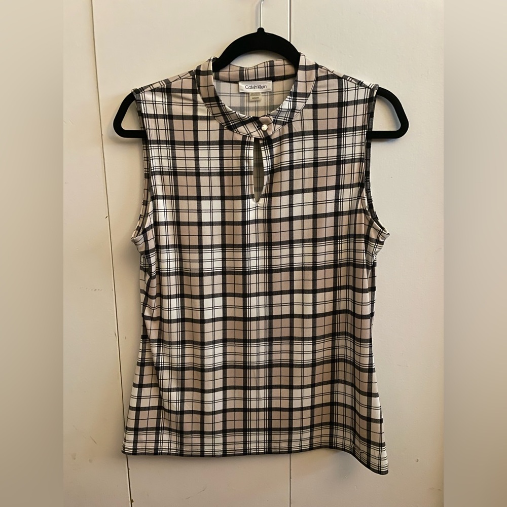 Calvin Klein sleeveless women’s blouse. Tan, cream and black striping. Size M.